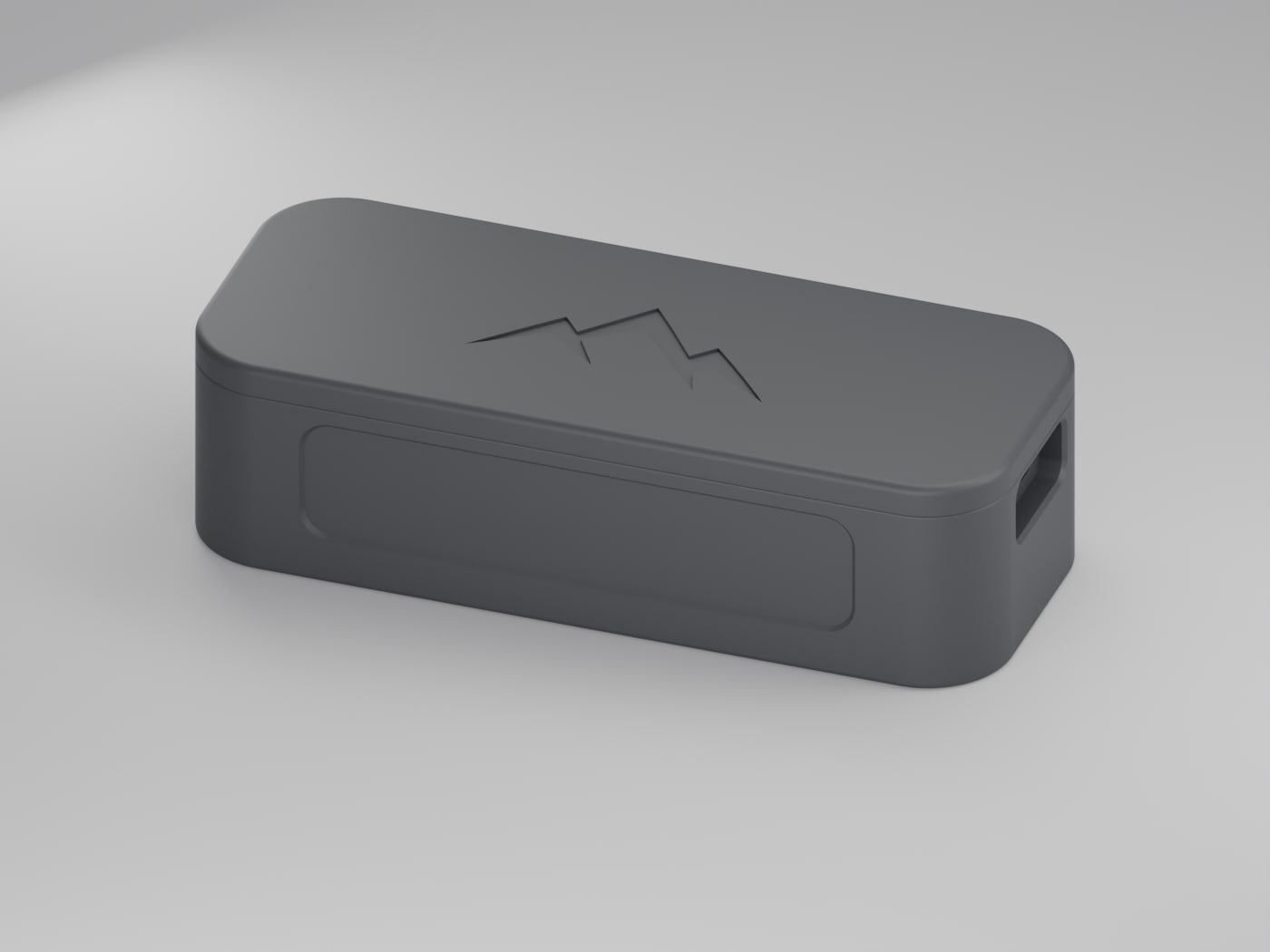 The NOMAE enclosure on a light studio background, showing its matte black finish