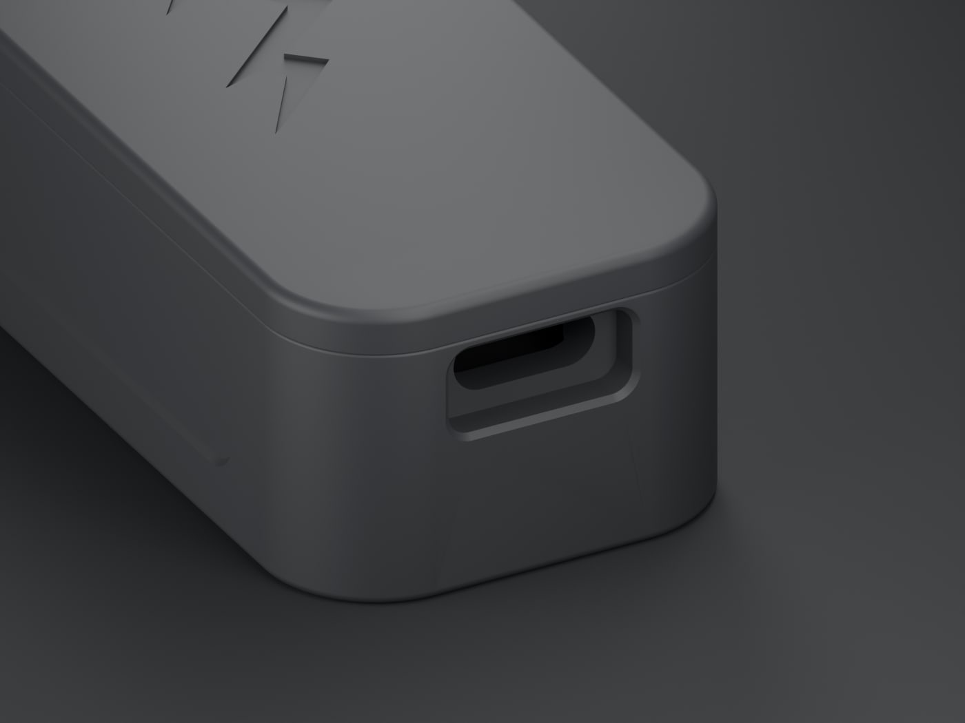 Close view of the recessed USB-C opening in the short end of the NOMAE enclosure