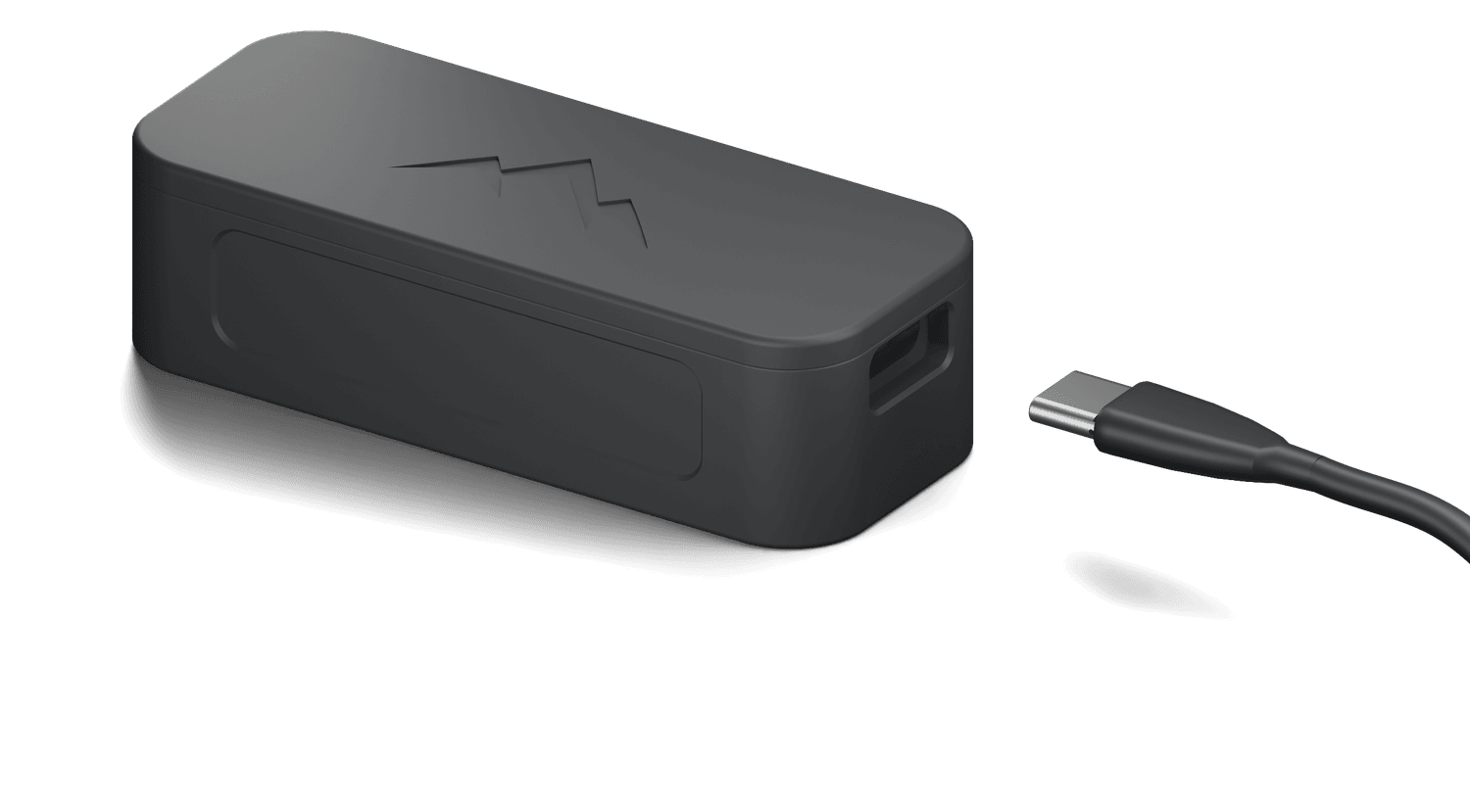 NOMAE, a matte black magnetic motion tracker with a debossed mountain mark on the lid, a USB-C cable at its open end