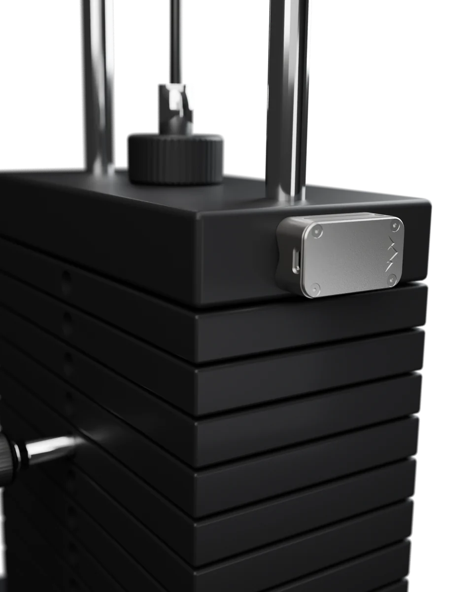 Render: the NOMAE tracker on the side of a gym machine's weight stack.